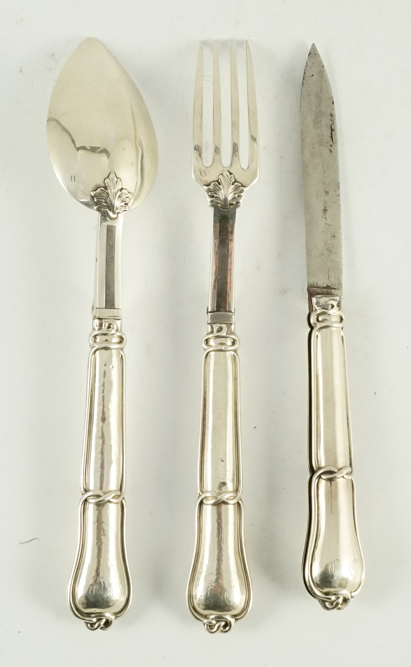 A 19th century French part silver campaign set, comprising a folding knife, fork and spoon, marks for Hippolyte Thomas, circa 1845-1855